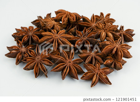 Anise stars isolated on white background. Fragrant seasoning, spice. Anise star close-up Anise stars isolated on white background. Fragrant seasoning, spice. Anise star close-up 121901451