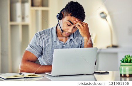 Stressed, tired and frustrated call center agent feeling sick or ill in the office while working on his laptop. A worried and unhappy young telemarketing employee suffering from a headache and pain Stressed, tired and frustrated call center agent feeling sick or ill in the office while working on his laptop. A worried and unhappy young telemarketing employee suffering from a headache and pain 121901506