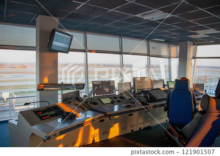 Dispatcher background. The workplace of the traffic manager at the airport at the tower. Chair, table, monitors, screens and equipment 121901507