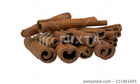 A bunch of cinnamon sticks isolated on a white background. Aromatic spices. Stack of Cinnamon stick selective focus 121901605
