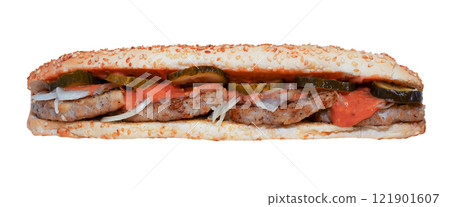 Long sandwich isolated on white background. Quick lunch - sesame bun. A simple sandwich with cutlet, chicken, lightly salted cucumber, onion and sauce on bread. Gas station menu 121901607