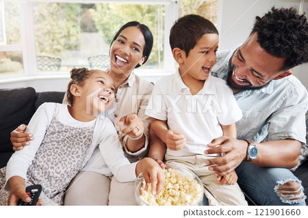 Family watching tv or a movie, having fun and eating popcorn together at home. Love and laughter with affectionate parents and happy children smiling, enjoying the weekend and feeling carefree Family watching tv or a movie, having fun and eating popcorn together at home. Love and laughter with affectionate parents and happy children smiling, enjoying the weekend and feeling carefree 121901660