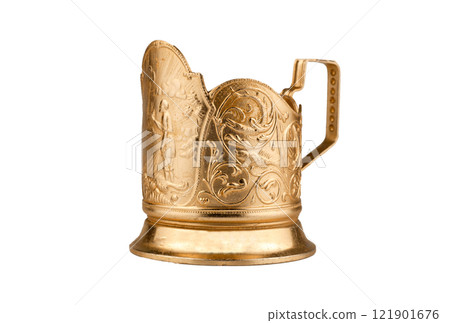 Cup holder isolated on a white background. Old gold-colored metal cup holder. Cup holder isolated on a white background. Old gold-colored metal cup holder. 121901676