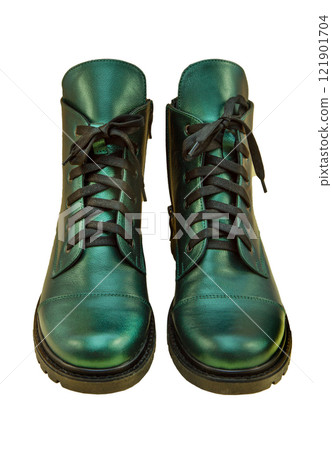 Green leather shoes isolated on white background. Winter and spring off-season boots. Stylish boot. Close-up. Laces, tractor sole. Casual style. Pearlescent fashionable color 121901704