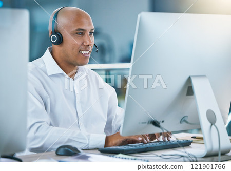 Professional, friendly customer service or sales consultant agency worker working with headset and desktop. Smiling male employee consulting with a client at call center or contact us helpdesk Professional, friendly customer service or sales consultant agency worker working with headset and desktop. Smiling male employee consulting with a client at call center or contact us helpdesk 121901766