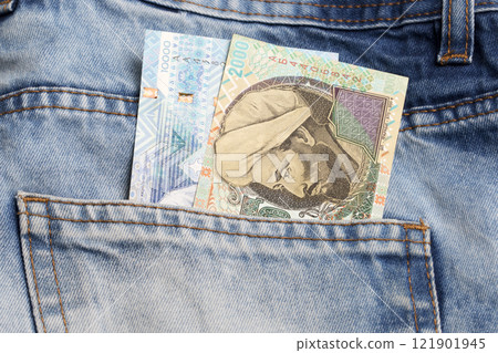 Kazakhstani tenge in the pocket of blue jeans 121901945