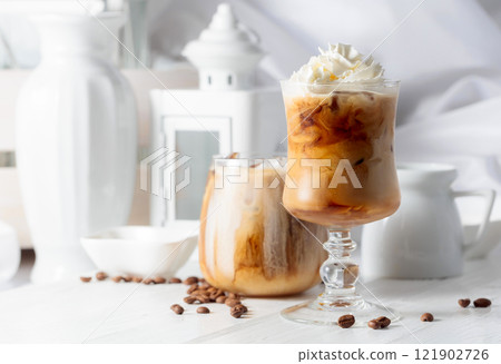 Iced coffee with cream and natural ice. 121902726