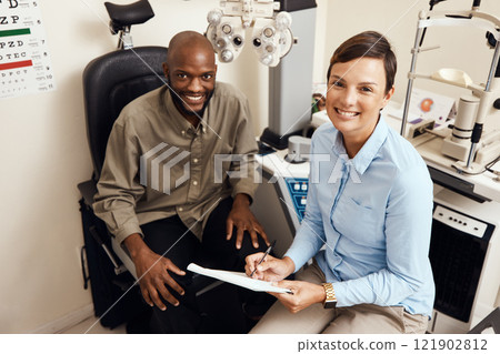 Optometrist, doctor and vision specialist doing eye test on patient in a clinic. Portrait of happy, smiling and friendly practitioner writing notes while giving good service for optical prescription 121902812