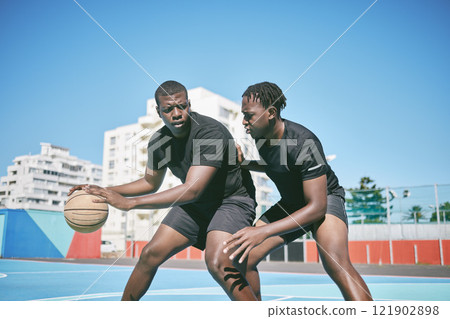 Basketball, fitness and active sports game played by young African men in an outdoor court for exercise. Training, workout and healthy guy friends playing a fun, friendly and athletic sport in summer 121902898