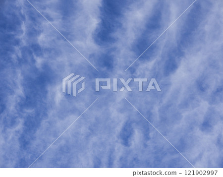 Delicate cloud patterns in the blue sky - a natural skyscape that gives a sense of healing and tranquility Delicate cloud patterns in the blue sky - a natural skyscape that gives a sense of healing and tranquility 121902997