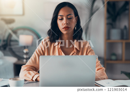 Elegant, professional and freelance worker on her laptop inside home office. Formal, stylish and fashionable corporate employee online. Remote, communication and sending emails in digital workplace. 121903014