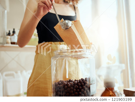 Plastic free, eco friendly and zero waste grocery store with consumer, shopper and customer buying ingredients and self service products. Woman purchasing fresh chocolate sweets in a supermarket shop Plastic free, eco friendly and zero waste grocery store with consumer, shopper and customer buying ingredients and self service products. Woman purchasing fresh chocolate sweets in a supermarket shop 121903199