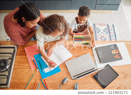 Learning, education and family doing homework with girl child writing in her book during homeschooling lesson with her mother from above. Student, development and studying during quarantine at home Learning, education and family doing homework with girl child writing in her book during homeschooling lesson with her mother from above. Student, development and studying during quarantine at home 121903271