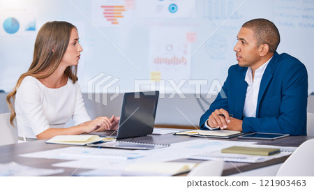 Collaboration, teamwork and planning team of social media marketing and advertising professionals talking in strategy meeting. A man and woman working on a messy office, workstation or workplace desk 121903463