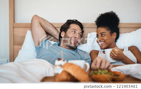 Valentines surprise, birthday or interracial couple celebrate womens day breakfast in bed by a romantic, husband for his wife together. Sweet, in love and loving man serving his lady food and bonding 121903481