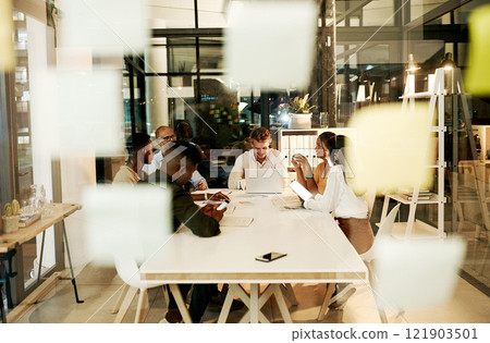 Professional, creative and casual business people in meeting with laptop, talking and planning a project together in an office at work. Diverse, happy and smiling team of workers discussing strategy 121903501
