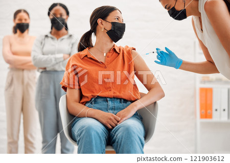 Vaccine, injection and medicine treatment for covid, flu and pandemic disease with nurse, healthcare or medical professional. Stylish, edgy and creative office woman with mask getting injected in arm 121903612
