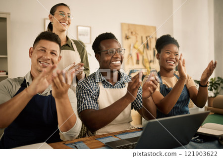 Clapping, cheering and excited fashion design team celebrate at workplace. Coworkers welcome and support employee promotion. Diverse group of happy, smiling creatives celebrating in a workshop. Clapping, cheering and excited fashion design team celebrate at workplace. Coworkers welcome and support employee promotion. Diverse group of happy, smiling creatives celebrating in a workshop. 121903622