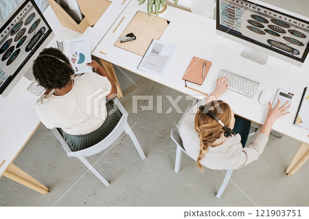 Marketing strategy, customer service and female office team working on a computer indoors. Female advertising staff planning a web work research project together with headsets inside 121903751