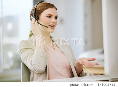 Sales consultant, call center agent and contact support employee helping clients with good customer service. Female working at the help desk busy talking and consulting about us and our loan prices 121903755