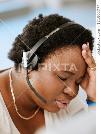 Burnout, headache and stressed female call center agent working with problem, bad mental health or stressful job. Sales representative or advisor feeling overworked, tired and exhausted 121903774