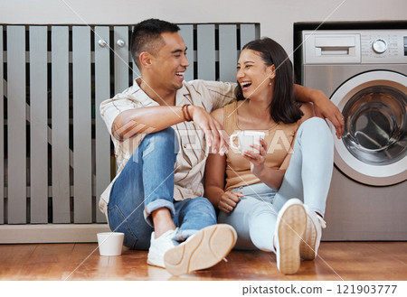 Happy, carefree and romantic couple bonding, laughing and having fun while sitting on the floor. Loving cheerful husband and wife having a cup of coffee, talking and relaxing in the kitchen at home Happy, carefree and romantic couple bonding, laughing and having fun while sitting on the floor. Loving cheerful husband and wife having a cup of coffee, talking and relaxing in the kitchen at home 121903777