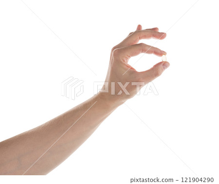 Male hand hold transparent pill isolated on white 121904290