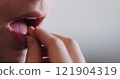 man takes pill closeup shallwo focus 121904319