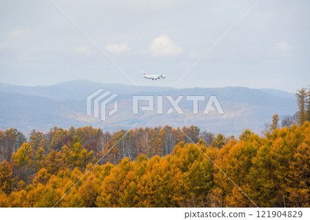 A plane flying over Biei in autumn to Asahikawa Airport A plane flying over Biei in autumn to Asahikawa Airport 121904829