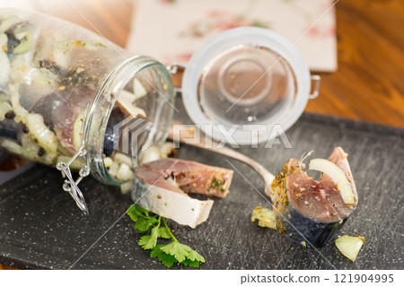 lightly salted mackerel sliced into pieces with onions and spices 121904995