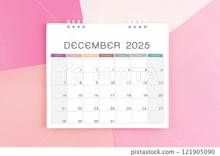 December month desk calendar for 2025 year on colorful background. 121905090