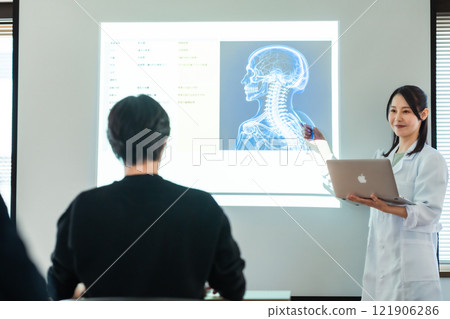 A researcher giving a presentation at the workshop 121906286