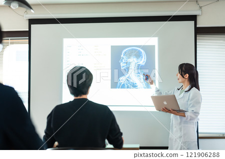 A researcher giving a presentation at the workshop 121906288