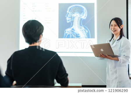 Doctor giving a presentation at a medical conference Doctor giving a presentation at a medical conference 121906290