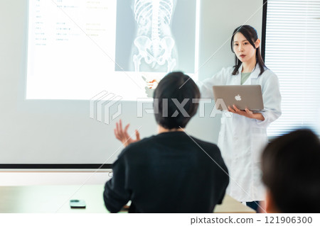 Doctor showing an x-ray at a medical conference 121906300