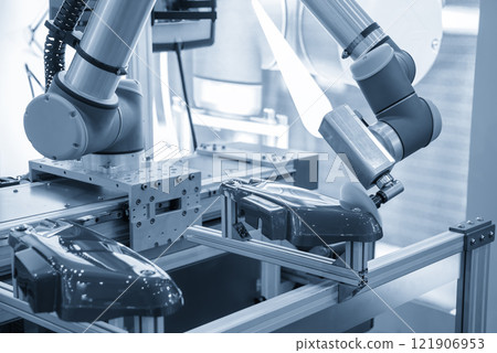 The automotive parts polishing process by robotic system in the light blue scene. 121906953