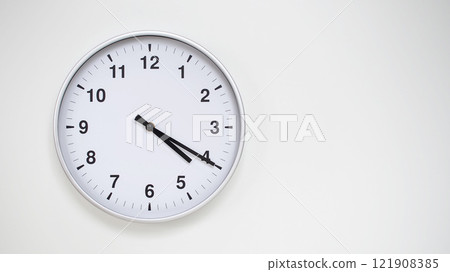 Minimalist White Clock with Silver Frame Striking 16.20/04.20 on White Background. Perfect for Time Management and Corporate Campaigns Minimalist White Clock with Silver Frame Striking 16.20/04.20 on White Background. Perfect for Time Management and Corporate Campaigns 121908385