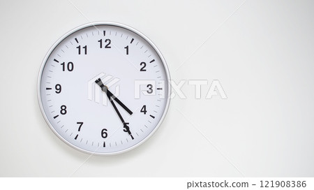 Minimalist White Clock with Silver Frame Striking 16.25/04.25 on White Background. Perfect for Time Management and Corporate Campaigns Minimalist White Clock with Silver Frame Striking 16.25/04.25 on White Background. Perfect for Time Management and Corporate Campaigns 121908386