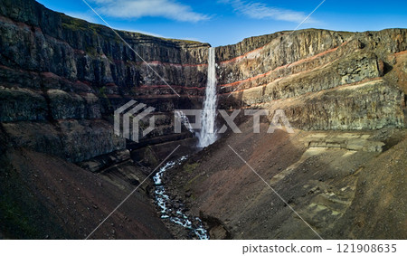 Hengifoss waterfall cascading down a layered rock face Hengifoss waterfall cascading down a layered rock face 121908635