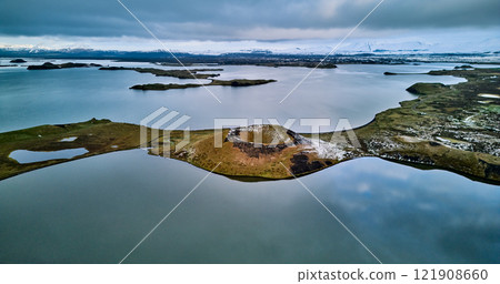 Volcanoes and the calm waters around Lake Mývatn 121908660