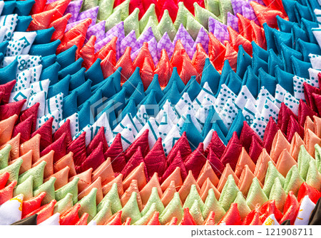 Creative background from handmade multicolored doormat. Texture of rug from different colorful fabrics Creative background from handmade multicolored doormat. Texture of rug from different colorful fabrics 121908711