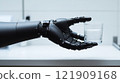 Robotic hand holding a glass of sparkling water in a modern setting. Advanced prosthetics, AI-driven precision, human-like robotics, and future innovation. 121909168