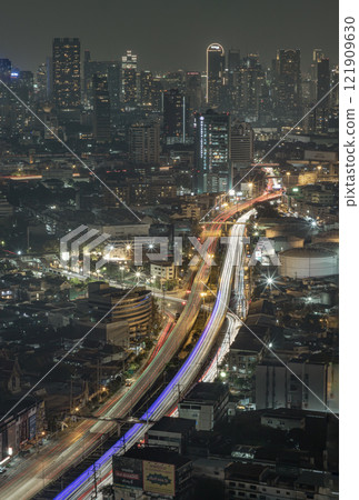 Night view of light trails of cars on the road of Bangkok city. 121909630