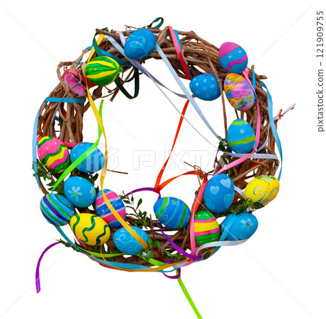 Easter wreath of vines and colored eggs isolated on white background. Festive decor on the door and in the house. Decorated egg - Pysanka. Easter wreath of vines and colored eggs isolated on white background. Festive decor on the door and in the house. Decorated egg - Pysanka. 121909755