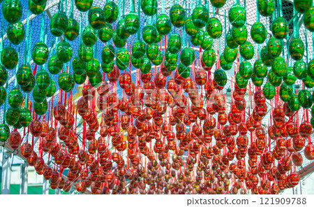 Easter background. Decorated with green and red eggs. Pysanka is a painted egg. Spring holiday concept. 121909788