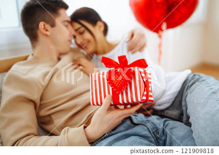 Exchange of gifts. Romantic day together. Valentines day, couple, relationships and people concept. 121909818