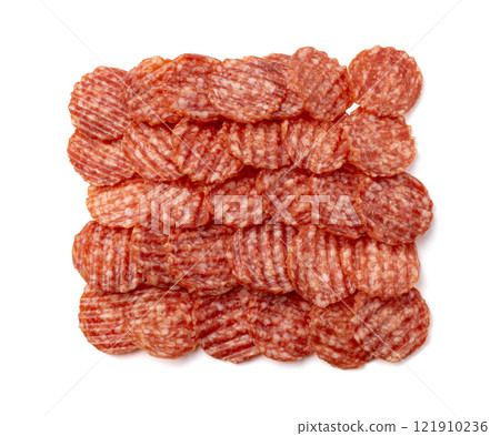 Salami chips isolated, wavy sausage slices, sliced dry chorizo, sausages thin pieces, pepperoni pizza ingredient Salami chips isolated, wavy sausage slices, sliced dry chorizo, sausages thin pieces, pepperoni pizza ingredient 121910236