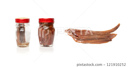Canned anchovy fillet, marinated fish, traditional salted anchovy in oil on white Canned anchovy fillet, marinated fish, traditional salted anchovy in oil on white 121910252