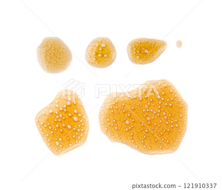 Spilled soda isolated, soft drink puddle, liquid stain, beer splatter, brown sparkling water with bubbles 121910337