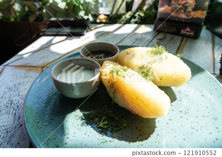 Lithuanian potato dumplings, cepelinai pancakes or kolduny, meat stuffed draniki, traditional didzkukuliai 121910552